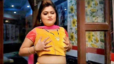 Chubby busty Indian MILF teasing in low-cut yellow top