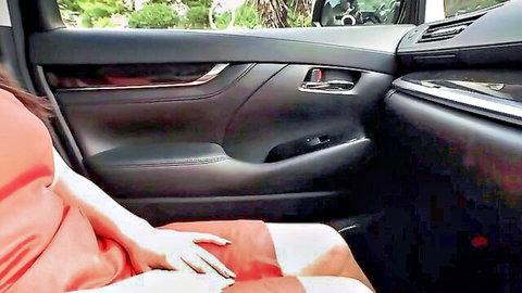 Curvy Asian hottie with massive boobs in tight red dress inside car