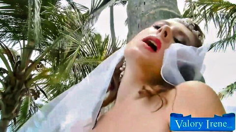 Valory Irene in sensual outdoor veil pose, busty blonde tease