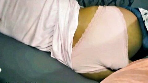 Hot stepmom Misty lying in pink lace panties, exposing curves in bed scene