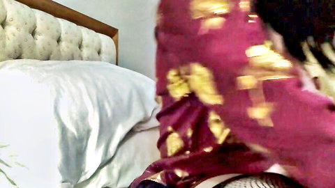 Crossdressing transman in red sari with bushy cunt and large clitoris
