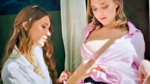 Young skinny lesbians with small tits expose bare breasts in open shirts during sensual close-up kiss