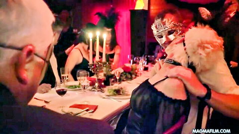 Masked big tits woman in lace dress gropes bald man at swinger dinner party