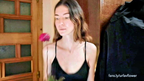 Urfavflwers seductive in black slip dress, holding pink flower, camshow tease