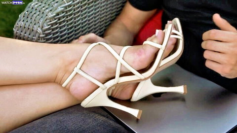 Melissa Stratton teases with feet in white strappy high heels, foot fetish closeup