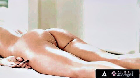 Nude Asian woman on massage table, big round ass in lesbian scene
