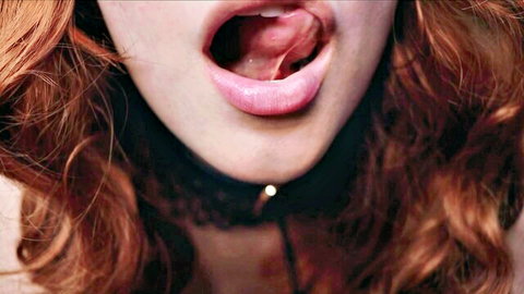Maimy ASMR redhead with open mouth and tongue out, wearing choker