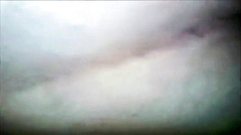 Blurry foggy white mist with no visible explicit action or nudity