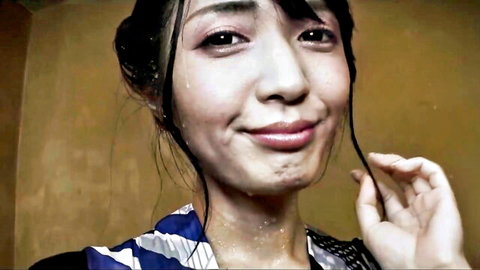 Hana Aoyama smiling with wet face and hair, wearing striped kimono top