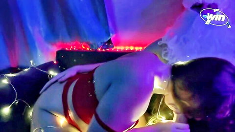 Curvy light-skinned bimbo in red harness seductive solo pose