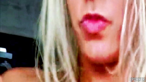 Blonde woman with red lips in seductive close-up from amoral nymph sex movie