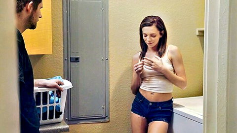 Tiffany Watson in crop top and denim shorts teasing in laundry room