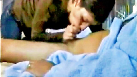 Man passionately kissing woman's neck in bed, intimate foreplay moment