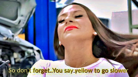 Brunette with glossy red lips and open mouth in garage reminds to say yellow safeword to go slower