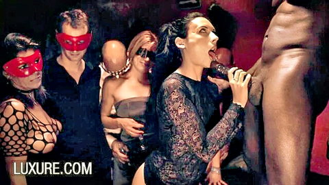 Brunette babe oral on black cock in hardcore swinger orgy at Luxure club