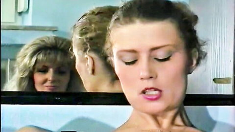 Sandra Fox close-up in lesbian fisting scene with blonde women