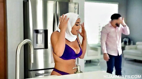 Hijab Arab MILF lifts scarf revealing huge tits in purple bra panties as shocked husband watches in kitchen