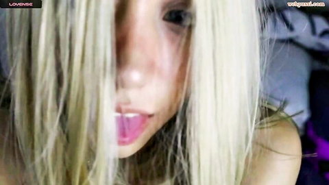 Blonde teen webcam girl sticks out her wet tongue seductively closeup