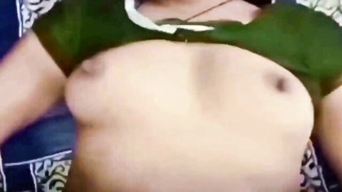 Curvy South Asian woman exposes massive bare tits and erect nipples in green lace top