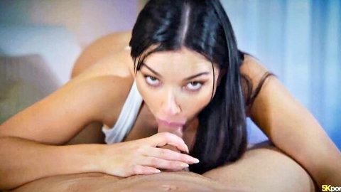 Brunette skinny babe with medium tits exposed gives intense POV blowjob gripping thick cock