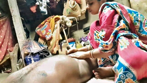 Indian woman in saree massaging naked man's back in steamy couple scene