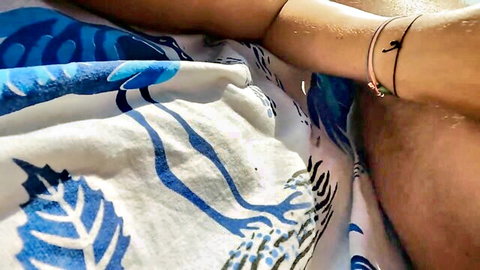 Close-up of woman's arm on beach towel in public jerk off voyeur scene