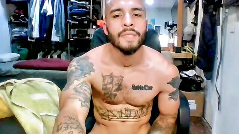 Tattooed muscular Latino bear Keelohsteel shirtless in gay solo preview