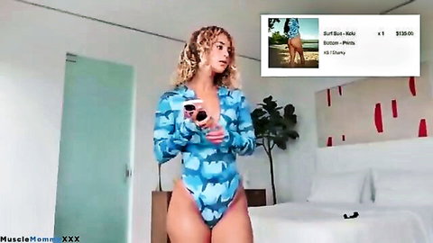 Curly-haired curvy model tries on tiny blue bikini in haul video