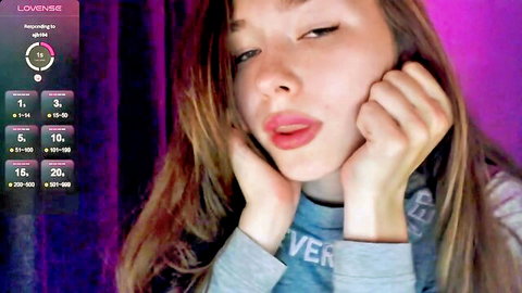 Hey Nora shy teen camgirl posing cutely with hands on cheeks, Chaturbate amateur