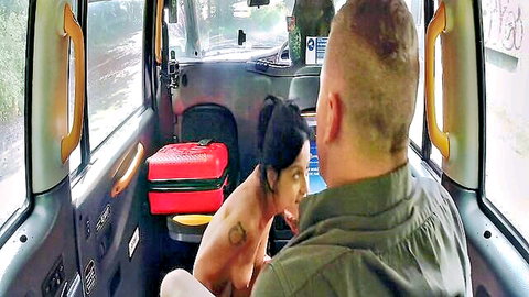 Topless skinny brunette with small tits rides man in public taxi backseat rough sex