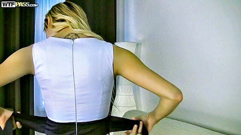 Olivia Devine blonde bending over in white top and black skirt