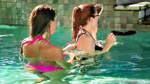 August Ames in wet pink bikini at pool with redhead friend