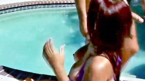 Long-haired Latina teases with slipping bikini by poolside
