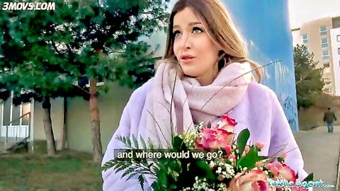 Marica Chanelle in pink fluffy jacket holding roses outdoors, thoughtful expression
