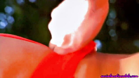 Exotic bombshell in red dress with cumshot on shoulder, hot close-up