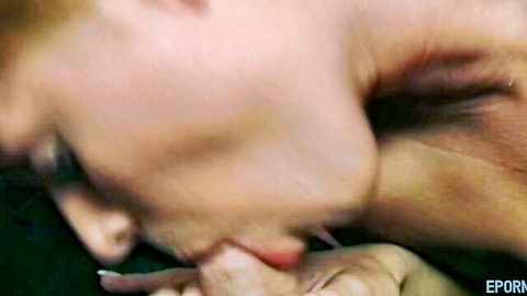 Close-up of woman performing intense blowjob with hand grip