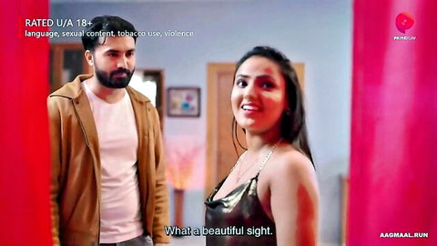 Indian MILF in shiny low-cut top smiles with bearded man in intimate pose
