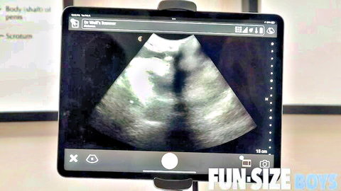 Ultrasound scan on iPad during doctor's medical exam in Fun-Size Boys gay fetish video