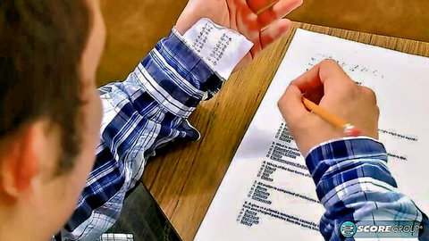 Student in plaid shirt writing at desk in teacher-student creampie fantasy