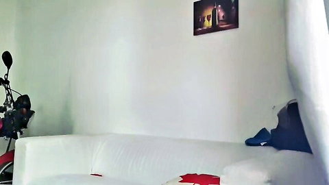 Empty white couch beside black motorcycle in cozy bedroom ready for hardcore fuck