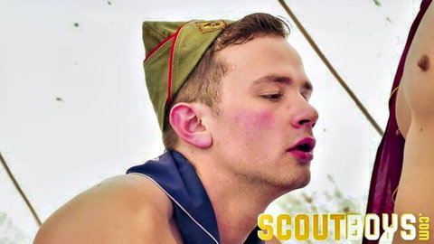 Scout boy in uniform giving oral to muscular man in hot threesome