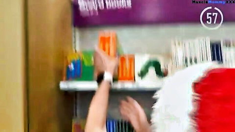 MILF Mommy reaching for toys on store shelf, charity shopping scene