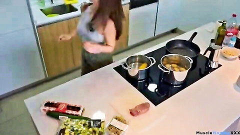 Fit brunette in tank top cooking healthy meal post-glute workout