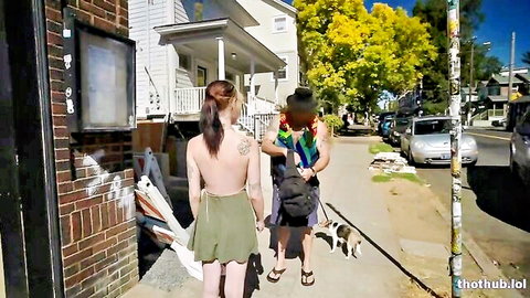 Rita braless in green skirt, walking outdoor with friend and dog