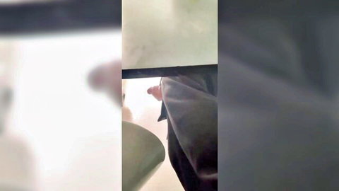 Blurry caught footage of man exposing at urinal in public bathroom