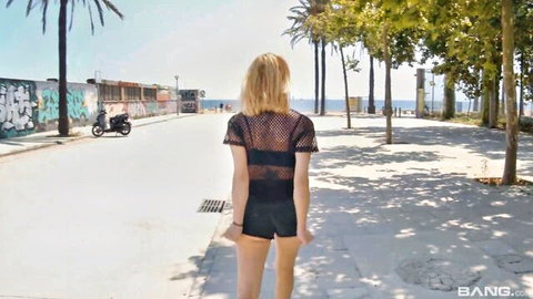 Perla Rubia in mesh top and shorts teases ass on sunny beach path