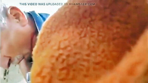 Elderly man in glasses close-up oral on bushy redhead outdoors bareback