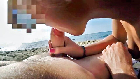 Brunette big tits woman handjobs huge cock on public beach outdoors