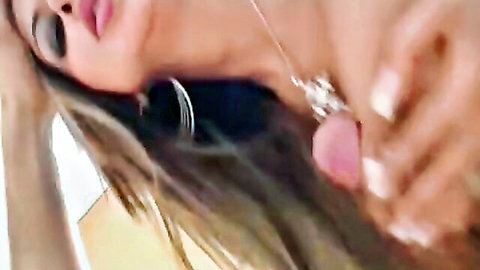 Anjali Kara seductive close-up with blonde hair and jewelry
