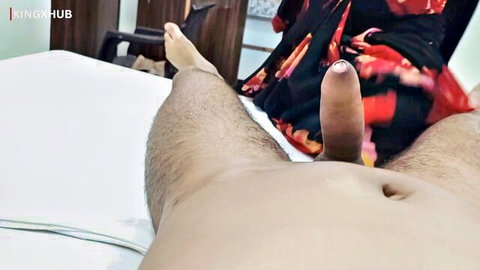 POV closeup of brown skinned man's erect thick cock near Indian woman's saree on bed